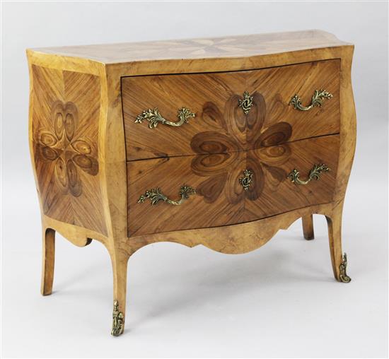 A late 19th century French oyster veneered and kingwood serpentine commode, W.3ft 6in. D.1ft 5in. H.2ft 9in.